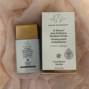 Drunk Elephant D-Bronzi Anti-Pollution Sunshine Drops – White & Gold